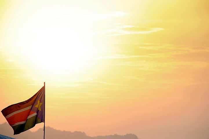 Southern Sudan: a southern Sudanese flag flutters at sunset 