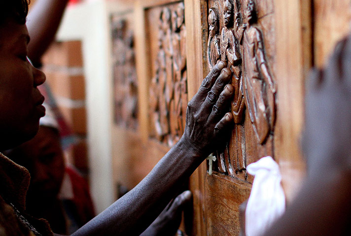 24 hours in pictures: Women pray at the doors of the Martyrs shrine in Kampala, Uganda