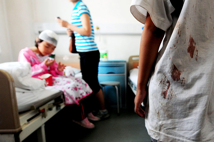 24 hours in pictures: An injured child receives treatment at a hospital in Beijing