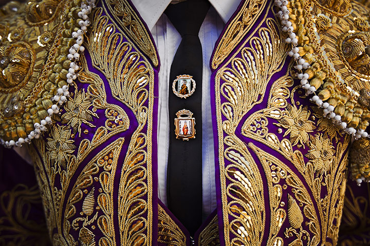 24 hours in pictures: Images of the Virgin Mary adorn a bullfighter's tie 
