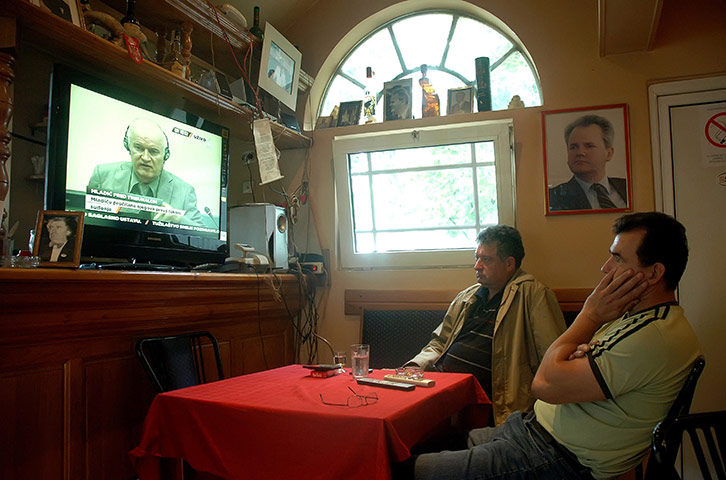 Ratko Mladic: Two men watch the live broadcast of Ratko Mladic appearance