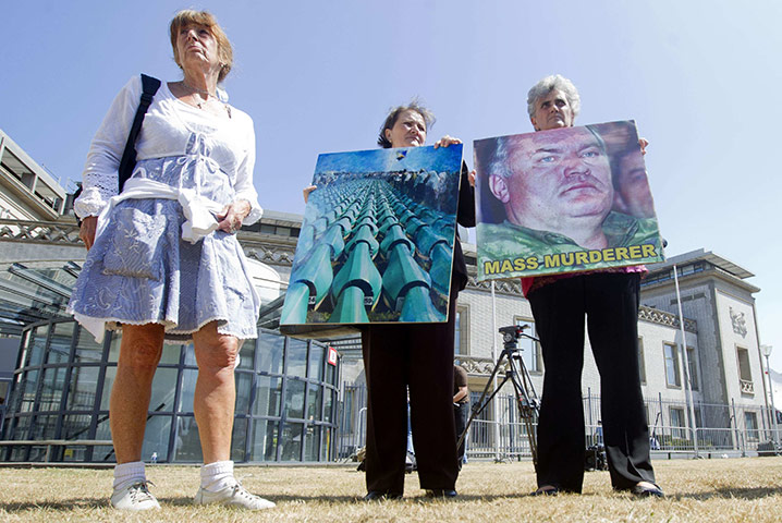 Ratko Mladic: Women from the Bosnian town of Srebrenica hold posters as they demonstrate