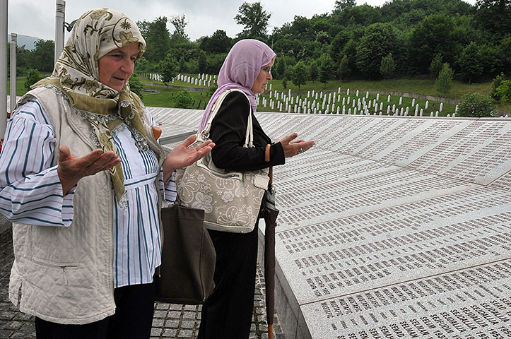 Ratko Mladic: Bosnian women pray at the memorial naming victims the Srebrenica massacre