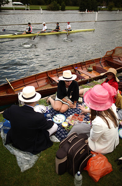 Henley Royal Regatta: Spectators enjoy a picnic as rowing crews compete