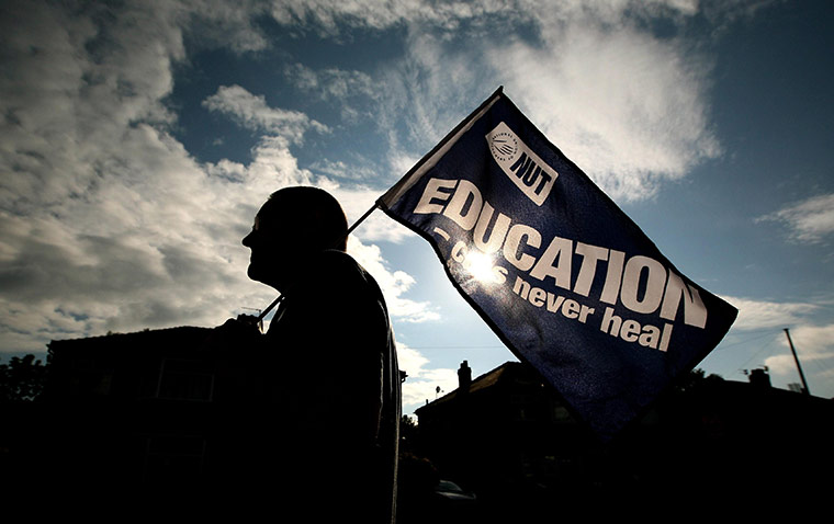 Public sector strikes: A teacher forms part of a picket line, Manchester