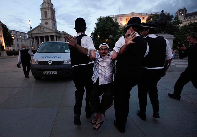 Public sector strikes: An activist in Trafalgar Square is removed by police