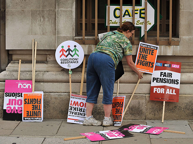 National strikes: A woman arranges placards