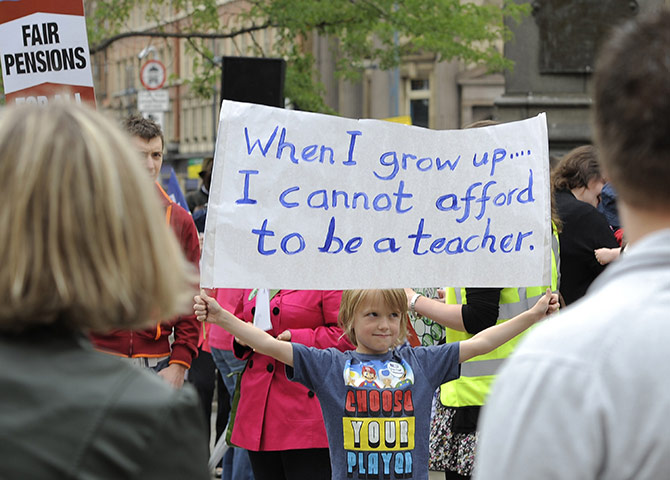 National strikes: Boy holds a banner during a protest over pension reforms in Leeds