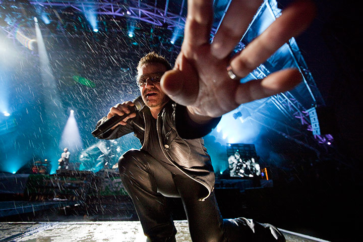 Glastonbury: U2's Bono reaches out to take the photographer's camera, Glastonbury festival