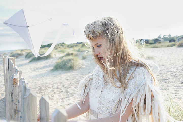 White fashion: Knitted hooded jacket