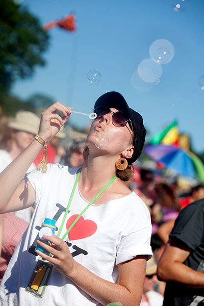 Glastonbury 2011: Festival goer blows bubbles at the Pyramid Stage