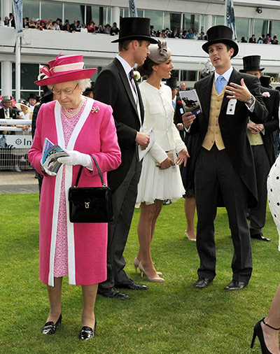 Day at the Epsom Races: Race goers enjoy the Epsom Derby