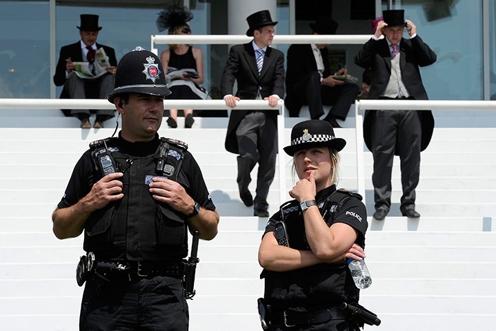 24 hours in pictures: Police officers stand on guard at Epsom Racecourse 