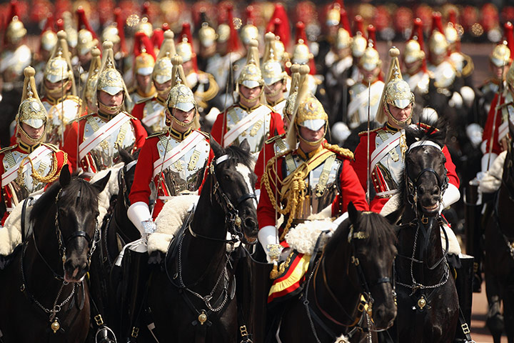 24 hours in pictures: oldiers return from Horse Guards Parade along the Mall, London