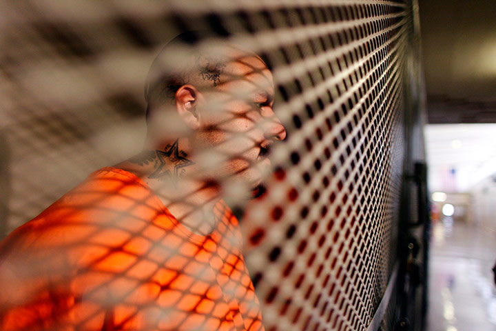 24 hours in pictures: Inmate sits in a cell at the California Institution for Men state prison