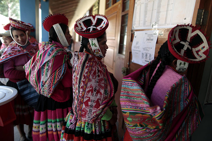 24 hours: Ollantaytambo, Peru: Quechua indigenous women stand in line to vote
