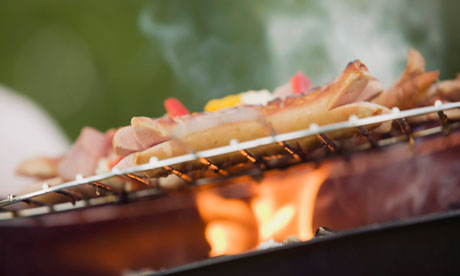 Sausages cooking on a barbecue