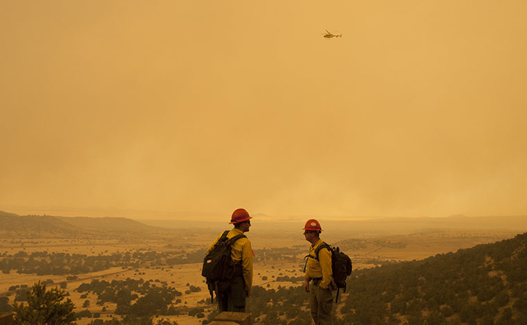 Arizona Wildfires: Firefighters watch for embers from a backburn