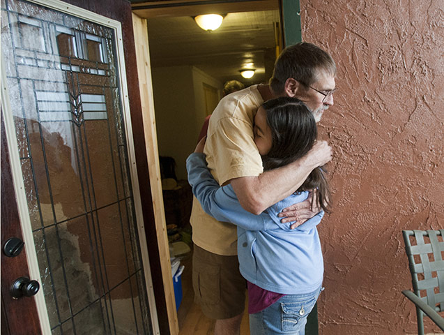 Arizona Wildfires: Tom Hollender gets a hug from neighbour Samatha Earl