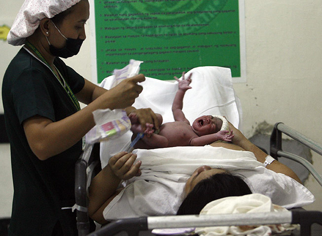 Manila maternity: A newborn baby cries after being delivered 