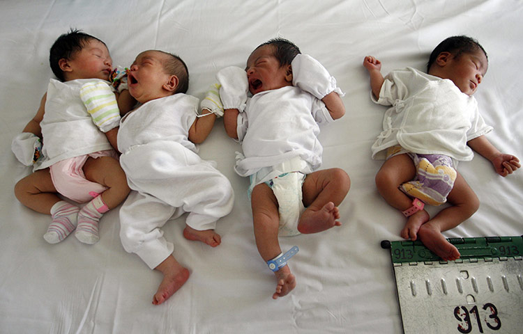 Manila maternity: Babies lie on a bed inside the maternity ward 
