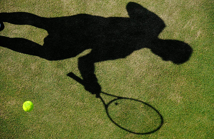 Queens tennis: The shadow of Janko Tipsarevic during his match with Michael Russell 
