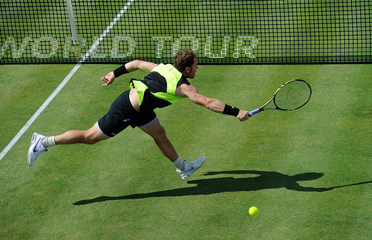 Queens tennis: Michael Russell misses a volley during his match with Janko Tipsarevic