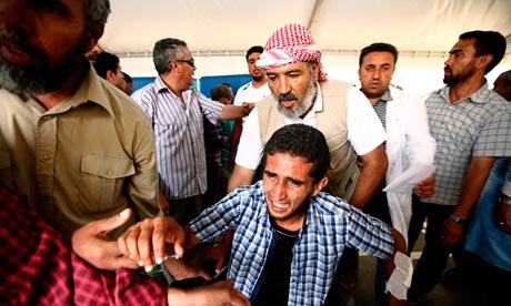 Injured Libyan rebel fighter