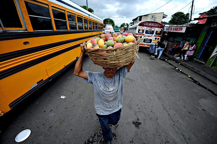 24 hours: Managua, Nicaragua: A man sells vegetables along a street