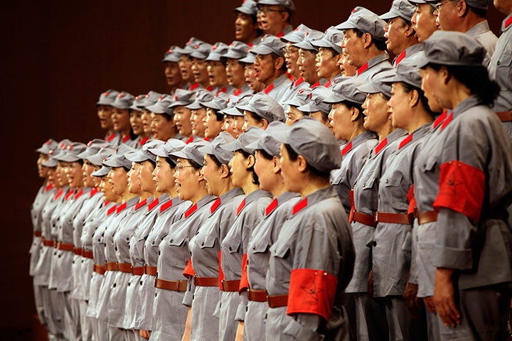 Communist Party 90th: Participants sing during contest, 90th anniversary of Communist Party