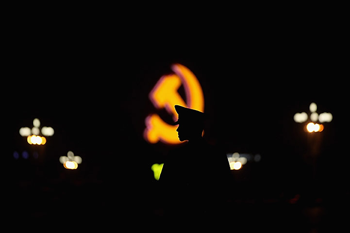 Communist Party 90th: Policement infront of CPC emblem, 90th anniversary of Communist Party