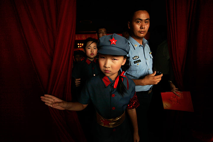 Communist Party 90th: A schoolgirl at singing competition, 90th annversay of Communist party