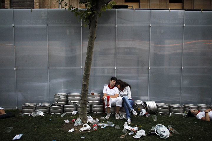 24 hours: Pamplona, Spain: Revellers sleep on the street at the San Fermin festival 