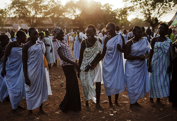 FTA: David Azia: Women from the Bari community laugh after performing a traditional dance