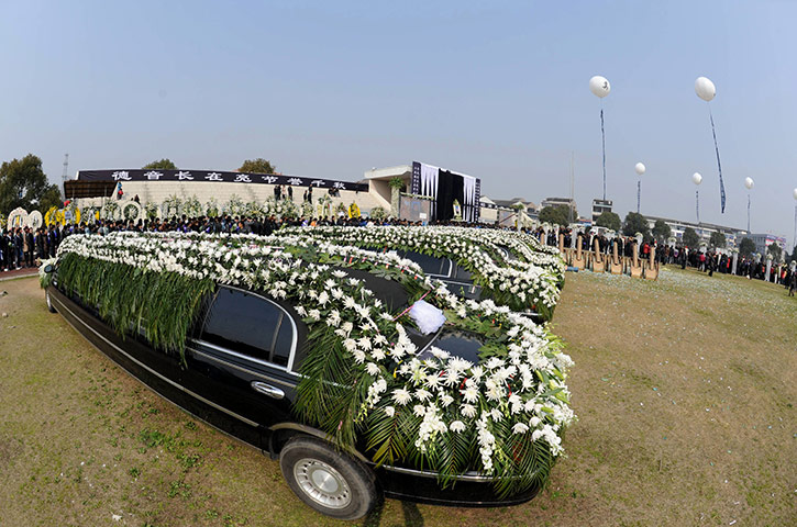 Luxury cars in China: stretch Lincoln limousines at a funeral in Wenling