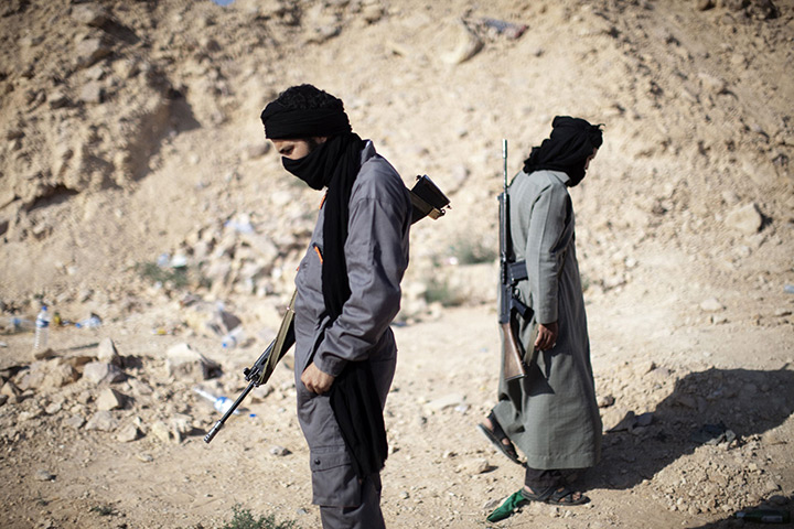 24 hours in pictures: Libyan rebels take position near the flashpoint hilltop town of Gualish