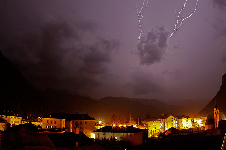 24 hours in pictures: Lightning strikes over the village of Predazzo, Italy