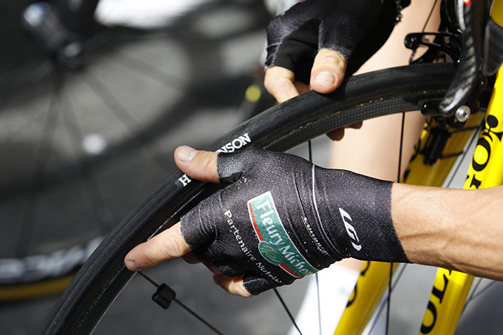 Tour de France Stage 12: Thomas Voeckler checks his tyre before the 12th stage of the Tour de France