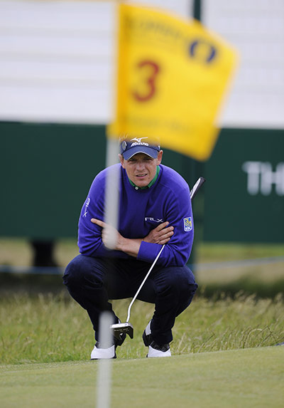 The Open: Luke Donald lines up his successful birdie putt on the 3rd green.