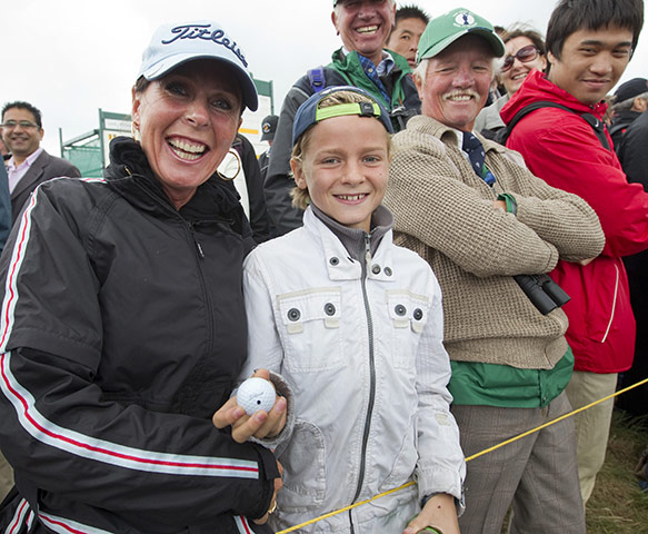 The Open: Derak, a young fan, from Holland is happy after receiving McIlroy's ball