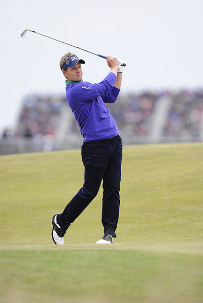 Open Golf: Luke Donald plays his 2nd shot onto the 18th green