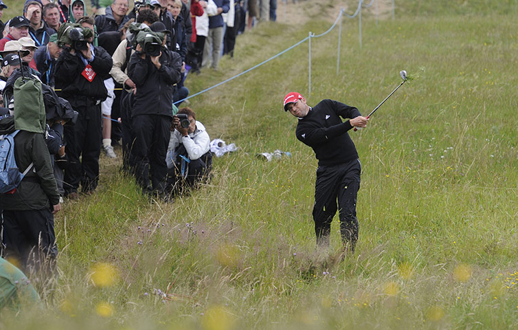 Open Golf: Sergio Garcia hacks out of the rough near 17th fairway