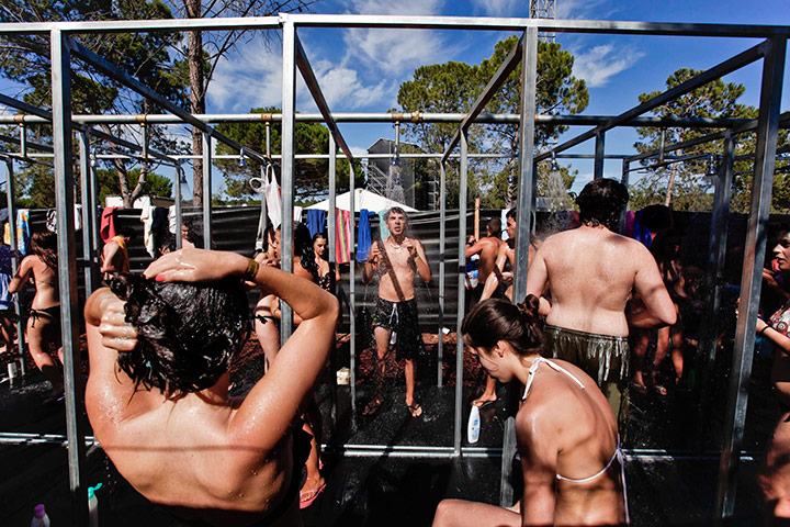 24 hours in pictures: Festival goers have a shower at Super Bock Super Rock festiva