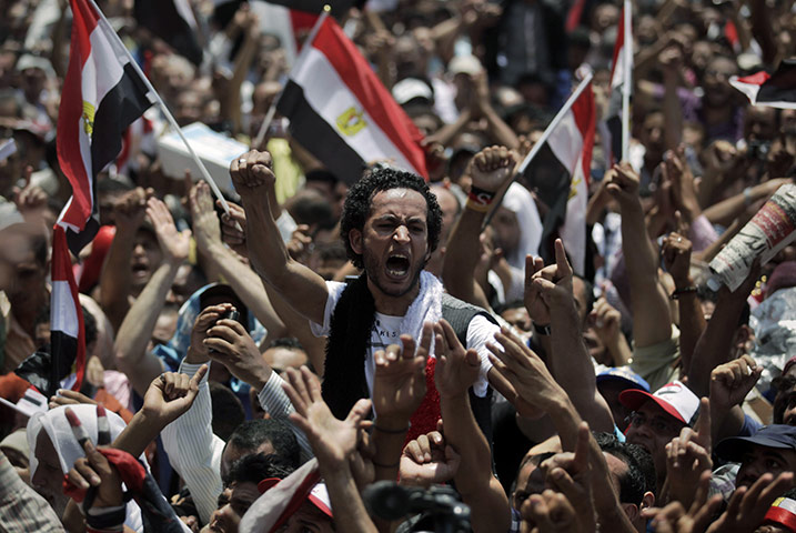 24 Hours: Protesters chant slogans during a demonstration in Tahrir Square