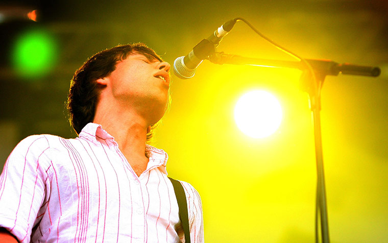 Latitude 2011: Cribs singer and bass player Gary Jarman performs on the Obelisk Stage