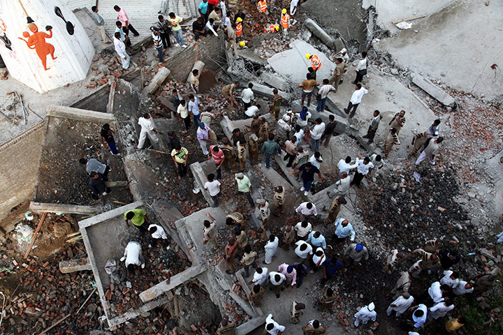 24 hours: New Delhi, India: A rescue operation under way after a building collapsed