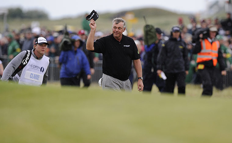 Open day 4: Darren Clarke acknowleges the applause of the crowd as he walks to the 18th