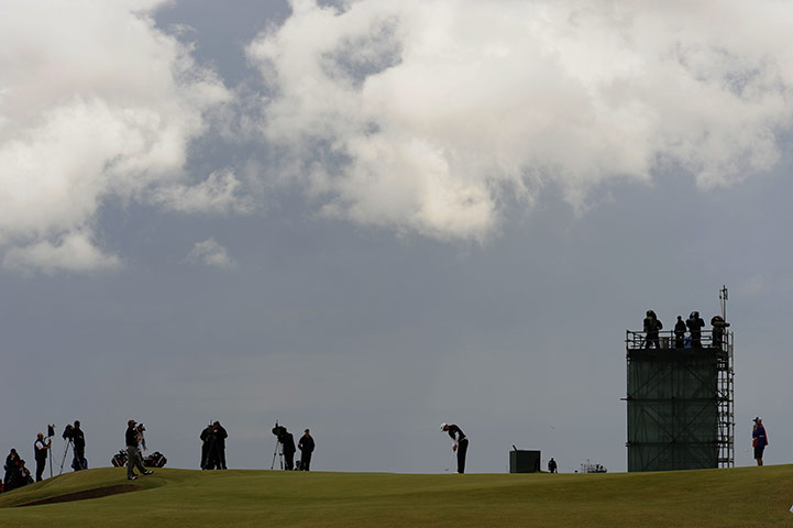 Open day 4: Dustin Johnson holes for birdie on the 10th under stormy skies