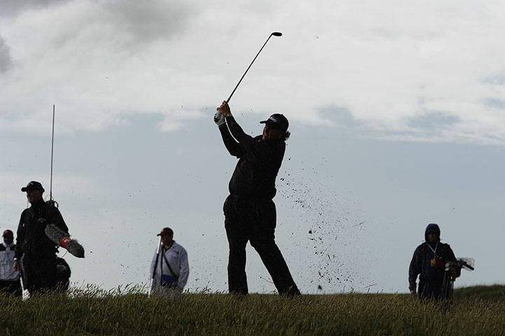 Open day 4: Phil Mickelson lofts his second shot from the long grass on the 14th