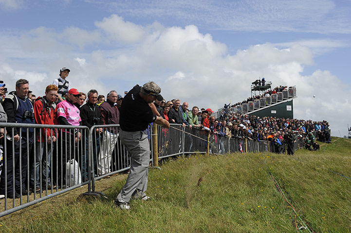 Open day 4: Darren Clarke hits the ball from the rough on the first hole